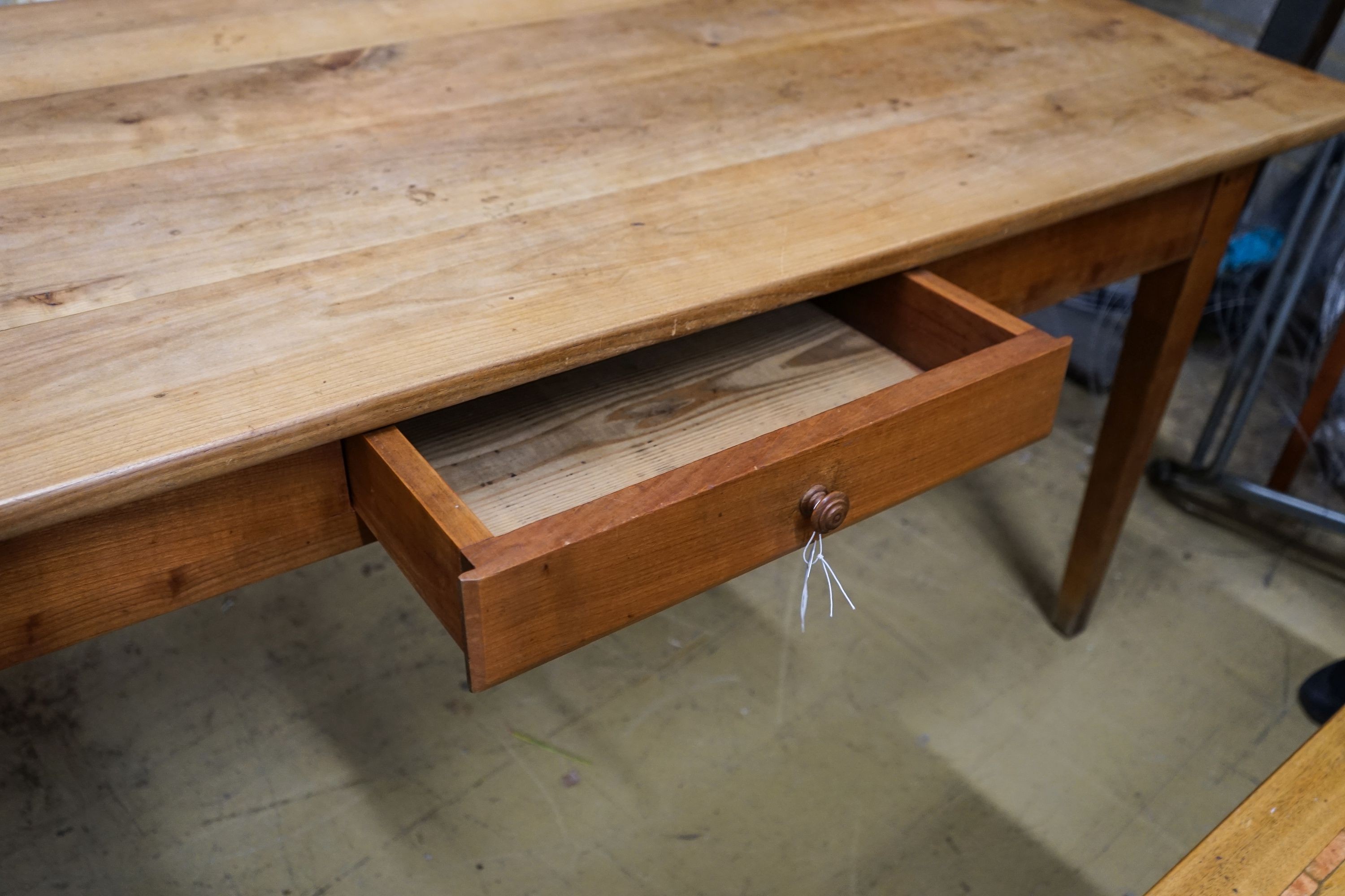 An early 19th century French cherry farmhouse table, fitted drawer, length 180cm, depth 82cm, height 76cm